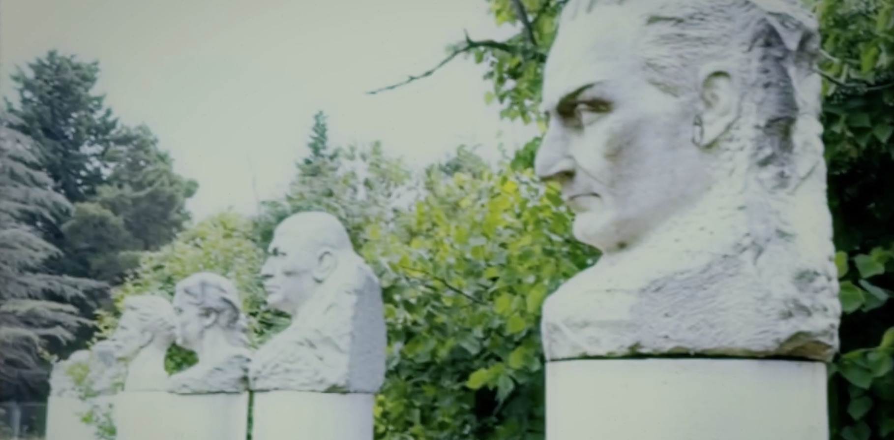Analog video frame of garden busts